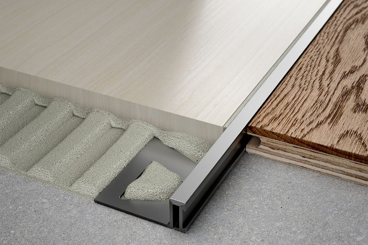 Schluter® DILEX-BWA perimeter joint profile isolates tile covering from fixed building elements