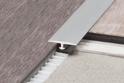 Schluter® VINPRO-T retrofit resilient surface floor profile for same-height transitions