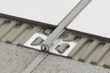 Schluter® DILEX-AKWS surface joint profile with 1/4” (6 mm)-wide PVC movement zone