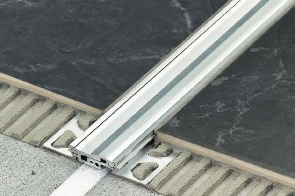 Schluter® DILEX-BT heavy-duty expansion joint profile with telescopic center