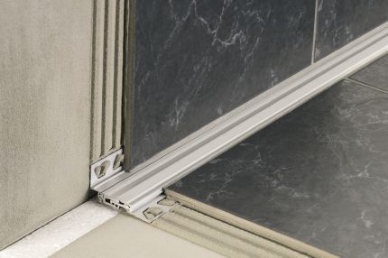 Schluter® DILEX-BTO expansion joint profile for bridging joints at floor/wall transitions