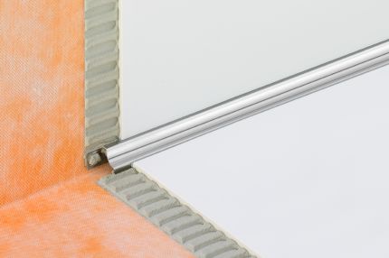 Schluter® DILEX-HKU stainless steel cove-shaped profile with inverted anchoring leg