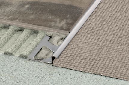 Schluter® RENO-TK edge-protection profile with minimum reveal for sloped transitions