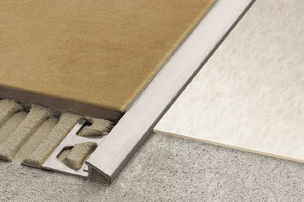Schluter® RENO-U edge-protection profile for abutting tile to lower transitions