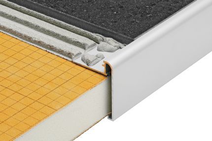 Schluter® RONDEC-STEP multi-functional profile covers the sub-assembly of countertops and stairs
