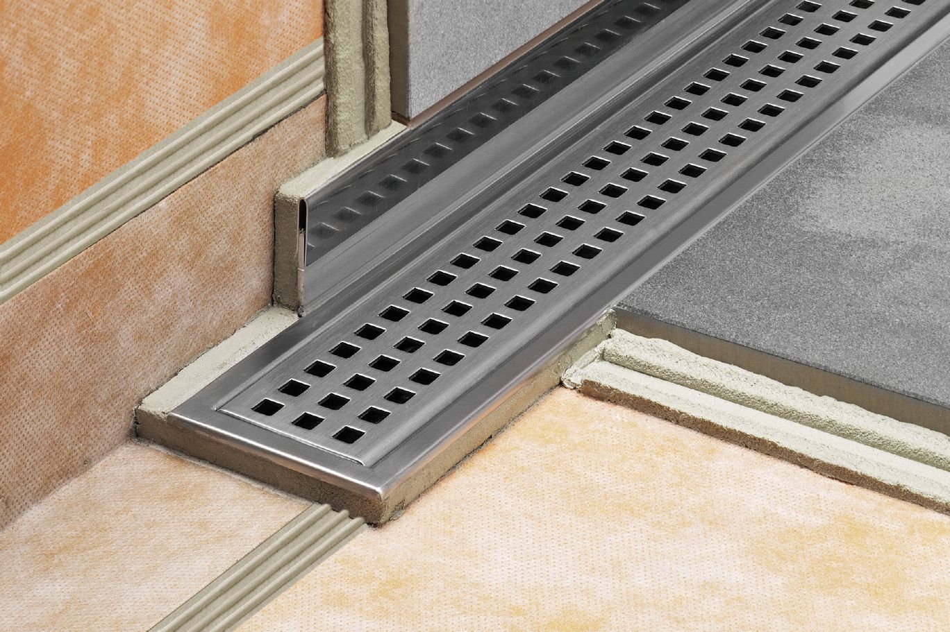 Schluter® SHOWERPROFILE-R transition profile covers exposed wall where floor slopes to linear drain