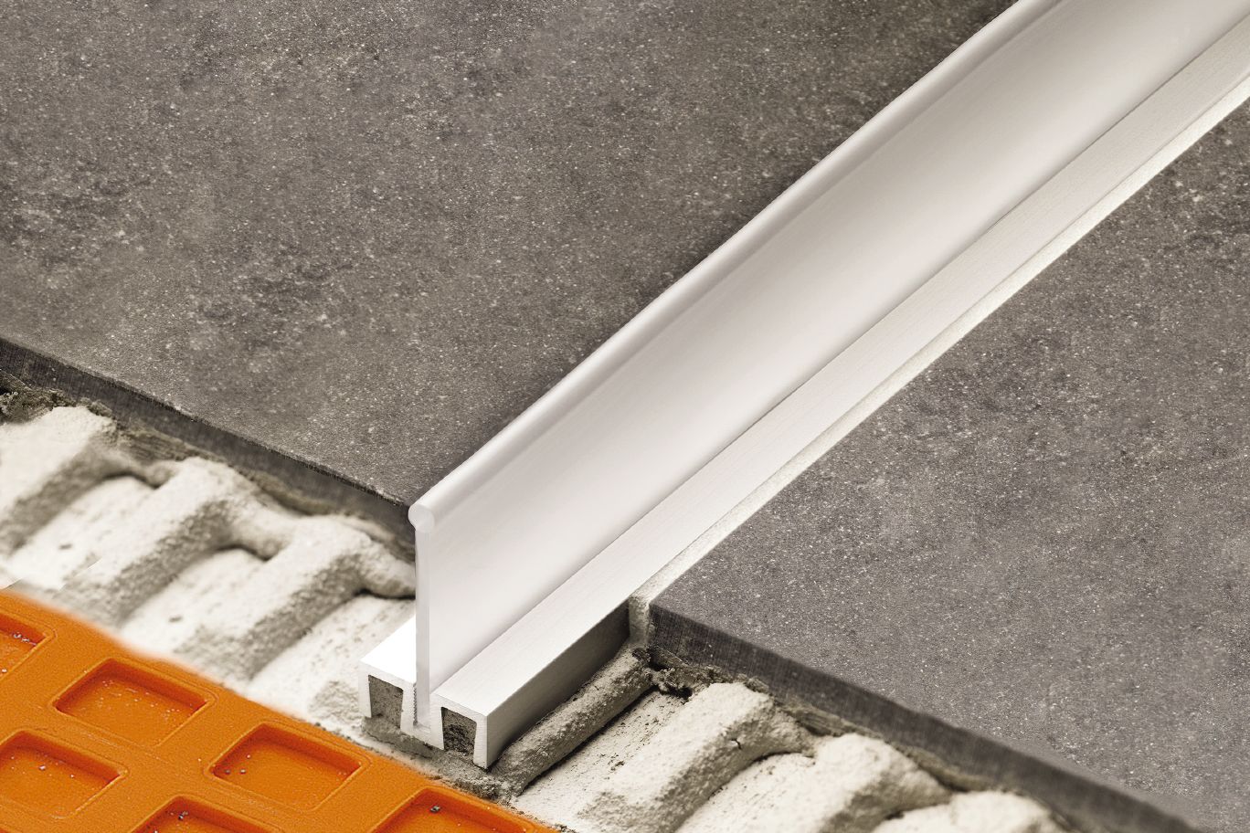 Schluter® SHOWERPROFILE-WS/-WSK profile that forms a splashguard in curbless showers