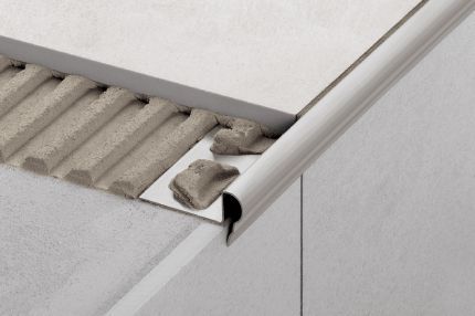 Schluter® TREP-FL stair-nosing profile with a decorative rounded edge
