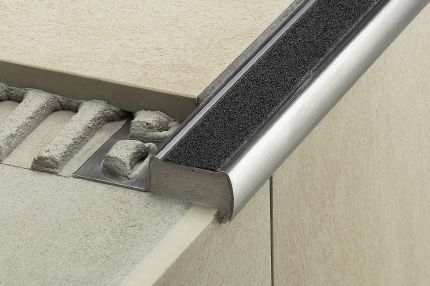 Schluter® TREP-G/-GK stair-nosing profile with replaceable non-slip tread, mineral grain coating