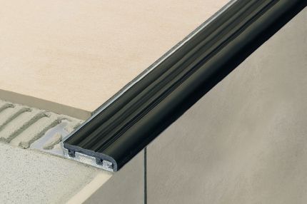 Schluter® TREP-SE-S-B stair-nosing profile with slip-resistant, thermoplastic rubber wear surface