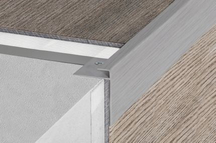Schluter® VINPRO-STEP-R resilient surface finishing profile for stairs with elongated reveal for increased visibility